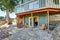 Backyard view of waterfront home with green siding