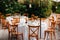 Backyard wedding reception - round tables with white tablecloths, vintage lanterns, roses and hyacinth,  and bentwood chairs