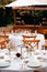 Backyard wedding reception - round tables with white tablecloths, vintage lanterns, roses and hyacinth,  and bentwood chairs