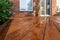 Backyard wooden deck floor boards with fresh brown stain