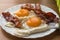 Bacon and eggs. Breakfast. Country style fried eggs with pork ham