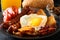 Bacon, grilled sausages, fried egg, beans, beans, toast, tomatoes, mushrooms fresh juice - full English breakfast