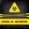 Bacteriological hazard sign and  No Entry COVID-19.  Concept of  Bacteriological hazard coronavirus. Yellow ribbon with text COVID