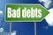 Bad debts word with green road sign