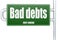 Bad debts word on green road sign