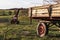 BAD DRIBURG, GERMANY - Apr 07, 2020: Farming trailer and an old mower from Gyro in the background
