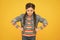 In bad humor. Moody little child yellow background. Little baby wear braided hairstyle. Little girl in casual style