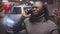 Bad news. African american black stressed man having unpleasant phone conversation in the underground parking