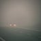 Bad weather driving - foggy hazy country road. Motorway - road traffic. Winter time