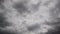 Bad weather time lapse scenic sky with smoky dense grey nimbostratus clouds move fast forward by the wind with dramatic light