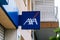 Badalona, Barcelona, Spain - April 24, 2021. Logo and facade AXA, French multinational specialized in the insurance business