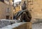 The Badaud statue by Gerard Auliac at the Freedom Square in Sarlat la Caneda in Dordogne Department, Aquitaine, France.