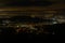 Baden-Baden night. Sparkling aerial view of downtown . Illuminated buildings and deep blue sky.