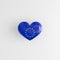 A badge in the shape of a heart with the European flag. Symbol of the European Union on a glossy badge. 3D rendering