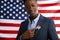 Badge US Election 2020 on suit of african american businessman