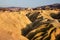 Badlands formations of Zabriskie Point, ancient desert colourful landscape, surreal landscape of world`s lifeless hottest place