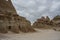 Badlands rock formations and cloudy sky