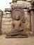 Badly damaged statue of a seated Buddha in Dhyana mudra meditation posture, Temple 45, Sanchi Buddhist Complex, Madhya Pradesh,