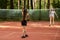 Badminton player on badminton court, two girls play in the park in nature, sports and recreation