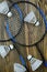 Badminton rackets and five white shuttlecocks on a brown wooden background