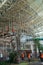 BADUNG/BALI-MARCH 28 2019: Some workers are putting together a scaffolding at the airport`s international arrival terminal