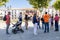 Baeza, Jaen, Spain - June 20, 2020: A group of unknown tourists with a professional tourist guide visiting the old city of Baeza
