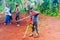 Bafoussam, Cameroon - 6 august 2018: young african boy victim of war landmine with broken legs walking with crutches in rural