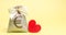 Bag with euro sign and red heart. Charity. Donation. Social help. Volunteering. Valentine`s Day. Saving money. Accumulation.