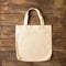Bag with handles made of natural cotton for shopping products wooden background. Ecology concept. Minimalism.