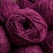 A bag of magenta acrylic wool its curly texture standing out in the image. Trendy color of 2023 Viva Magenta.. AI