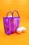 Bag to go to the market, sent or super Mexican style, with white eggs inside, on an orange background