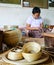 BAGAN, MYANMAR- SEPTEMBER 12, 2016: Burmese people making lacquerware dishes at a local factory in Old Bagan