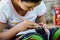 BAGAN, MYANMAR- SEPTEMBER 12, 2016: Burmese people making lacquerware dishes at a local factory in Old Bagan