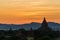 Bagan temples at sunset against mountains