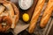 Bagel and bread in basket with baguette and lemon