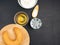 Bagel on a cutting board, flour, salt, water, egg on a black background