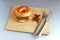 Bagel with salmon on a cutting board