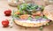 Bagel sandwich with creame cheese, salmon, onion, tomato, greens, ch