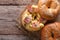 Bagel with scrambled eggs and bacon close-up horizontal top view