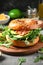 Bagel with sesame seeds with salmon avocado and arugula on wooden cutting board. Balanced diet whole food nutrition