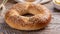 Bagel with sesame seeds on a wooden table