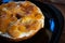 Bagel sponge cake breakfast with apple jam and coffee in red cup and Italian coffee pot on wooden table