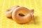 Bagels close up. Small dry bagels on a yellow background. Selective focus