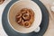 Bagels in a plate on the table. Delicious and appetizing in a light plate.