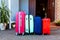 Baggage blue pink orange house sun summer luggage family car ready holidays plant green four