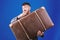 Baggage insurance. Man well groomed bearded hipster with big suitcase. Take all your things with you. Heavy suitcase