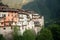 Bagolino medieval village. Old buildings and forested slopes.