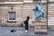 Bagpipe player next to the David Hume statue in Edinburgh