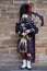 Bagpipe player in traditional scottish kilts in Edinburgh