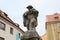 Bagpiper sculpture on a top of the fountain in the old town, Cheb, Czechia